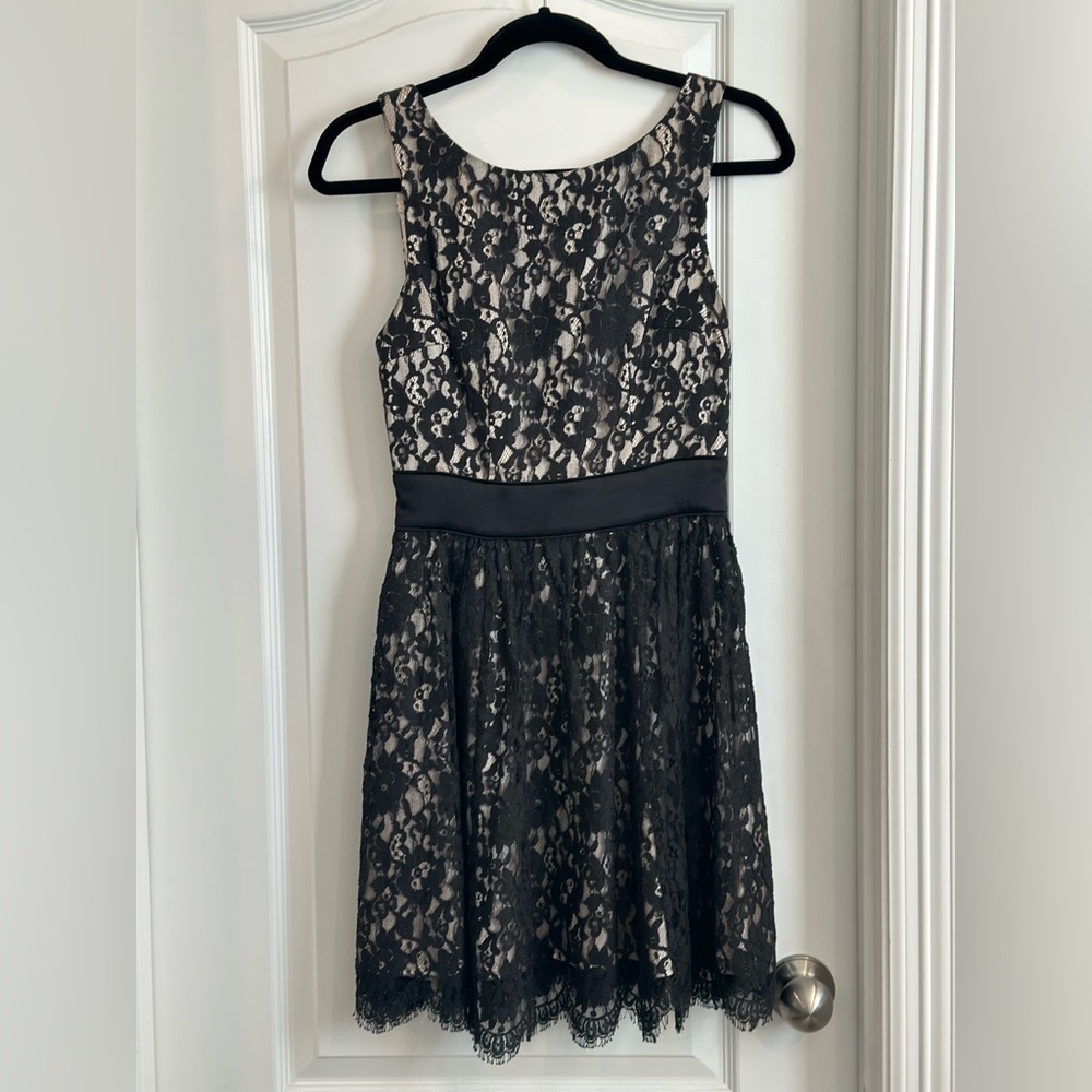 Black and gold lace dress. Black lace draped over sold gold. V cut back.